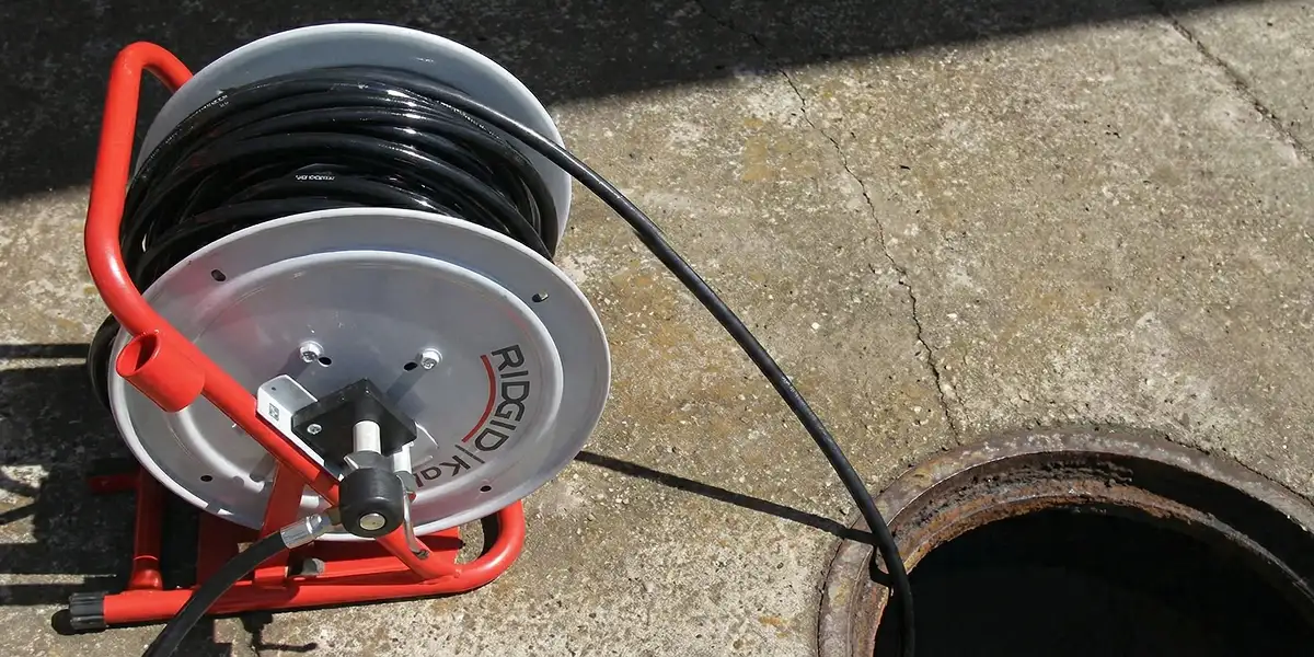 sewer rodding equipment prepared to clear clogged sewer lines in Grand Rapids, MI